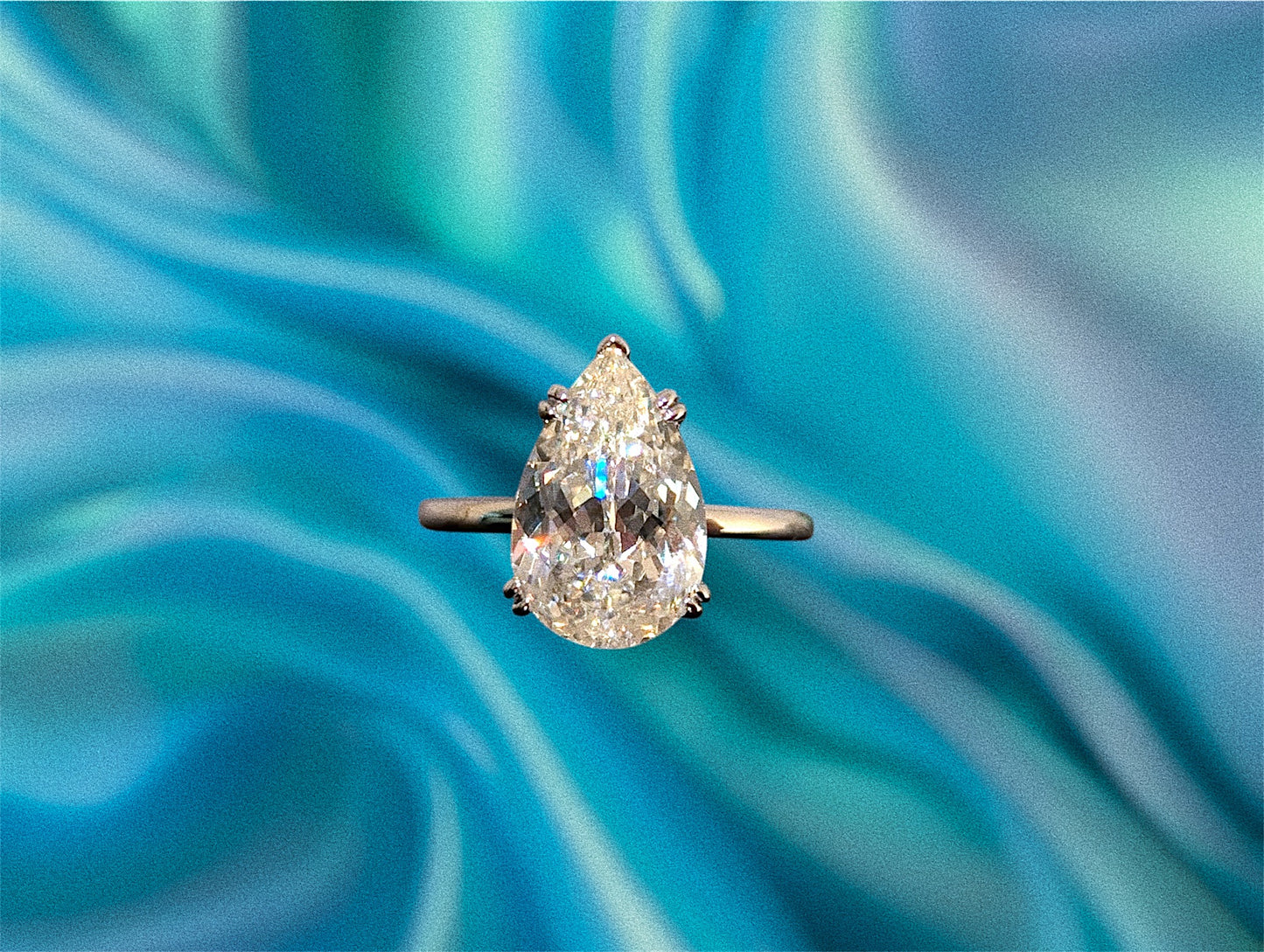 Classic pear solitaire ring